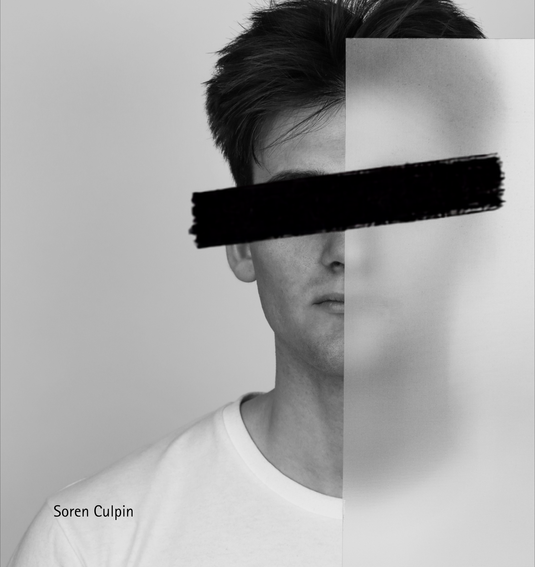 Soren Culpin holding a panel across the right side of his face, with a black bar obscuring his eyes